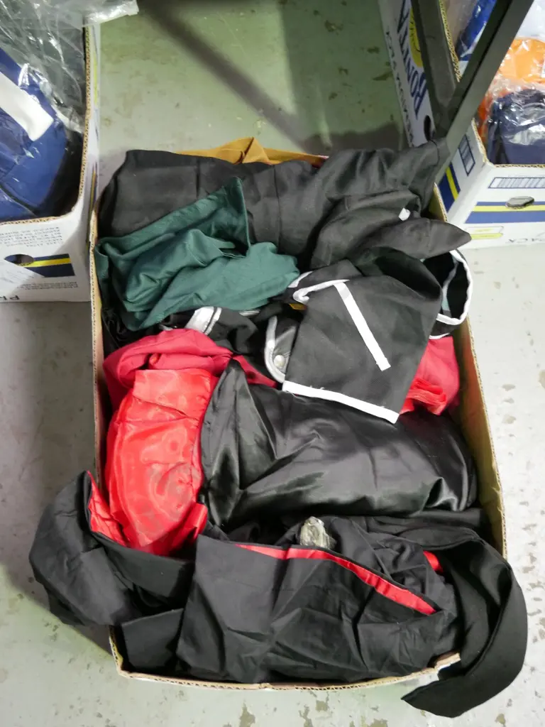 box of opened costumes Image 1++