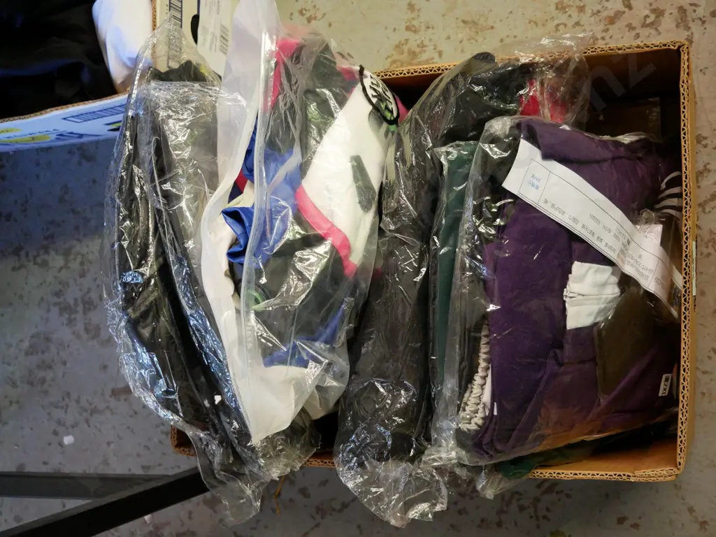 box of unopened costumes Image 1++