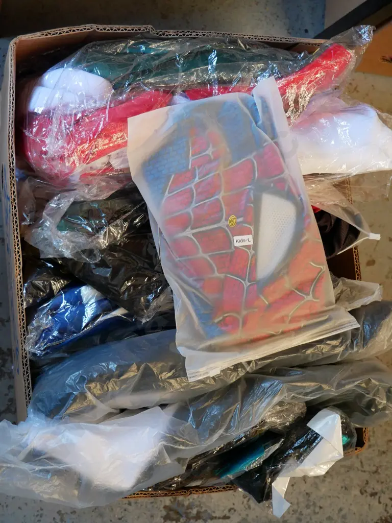 box of unopened costumes Image 1++