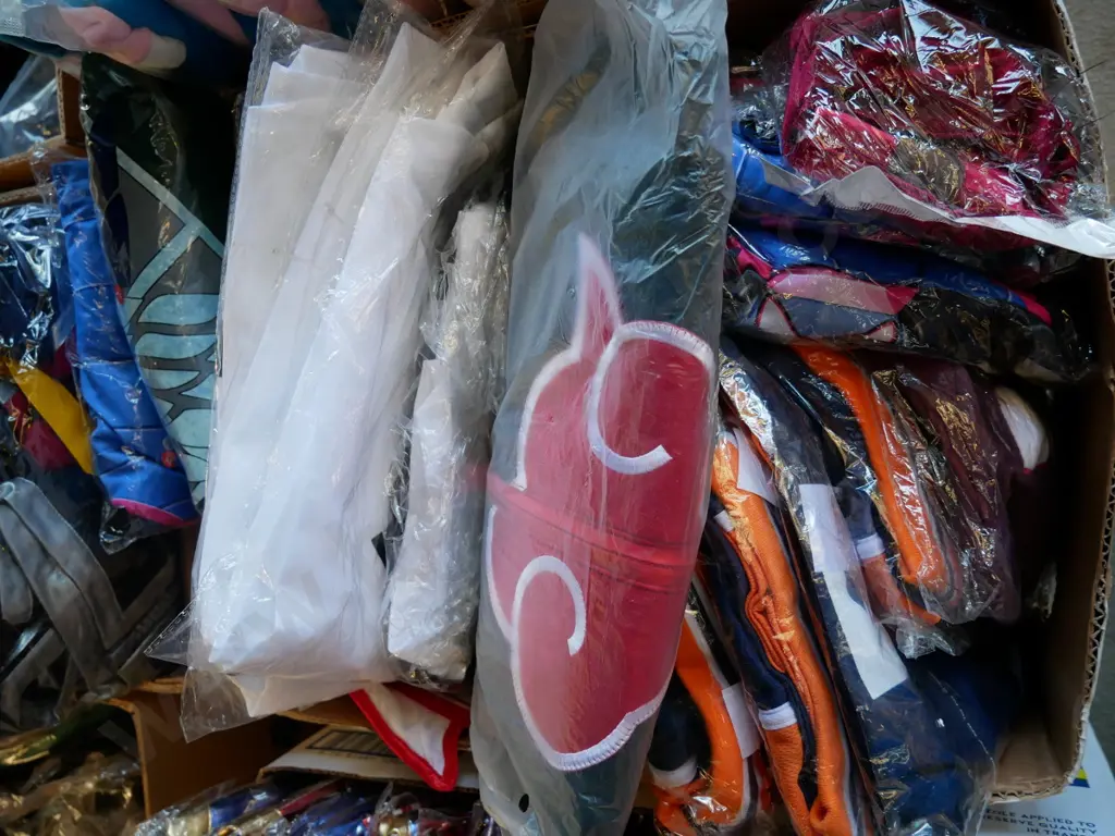 box of unopened costumes Image 1++