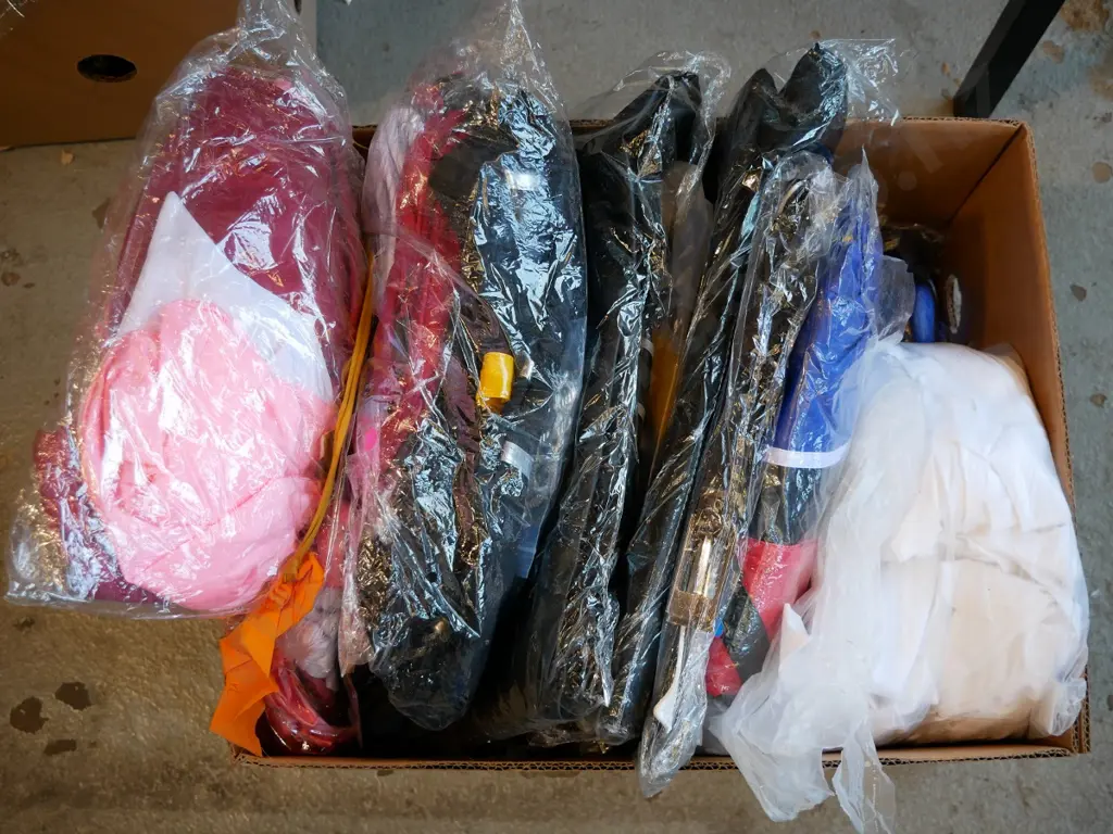 box of unopened costumes Image 1++