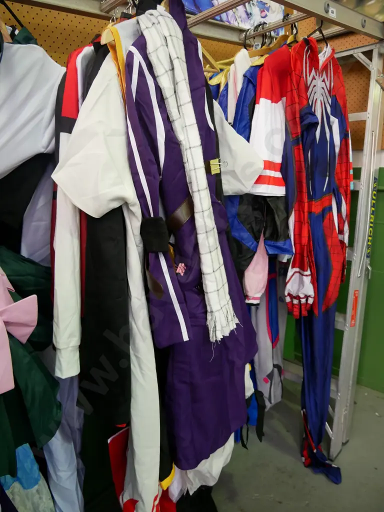 rack of assorted costumes Image 1++