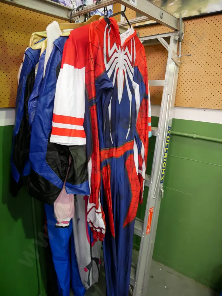 rack of assorted costumes Image 1++