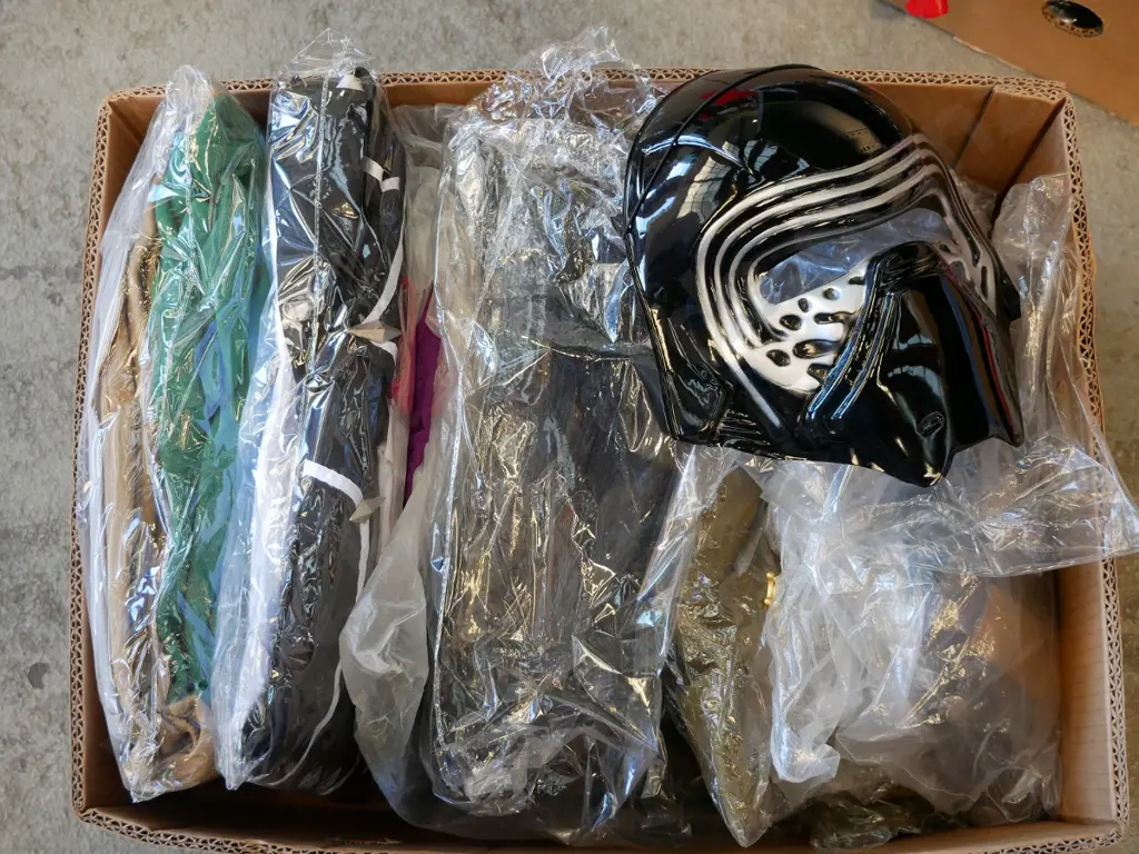 box of unopened costumes Image 1++