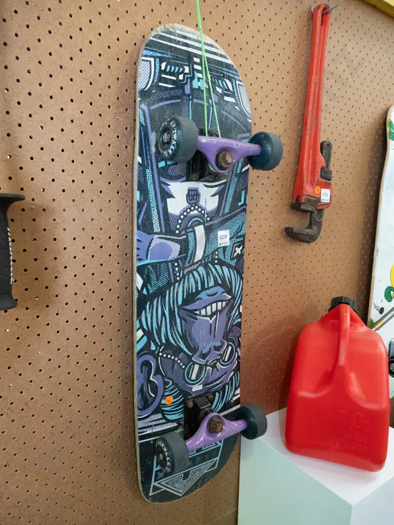 Airwalk skateboard with purple and blue underside Image 1++