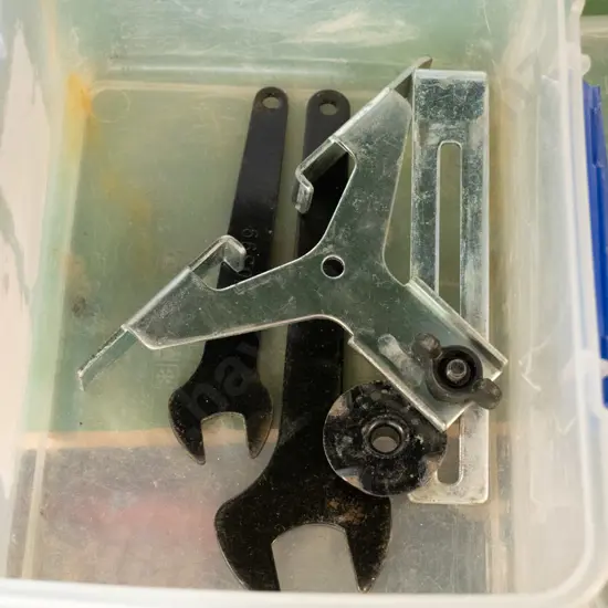 Clear plastic container with blue and contents