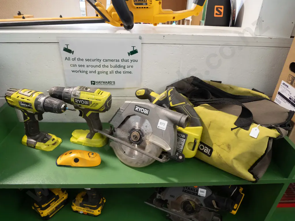 Ryobi branded canvas tool bag with 2 x Ryobi battery drills and Ryobi battery skill saw Image 1++
