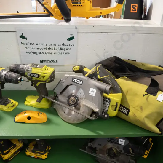 Ryobi branded canvas tool bag with 2 x Ryobi battery drills and Ryobi battery skill saw