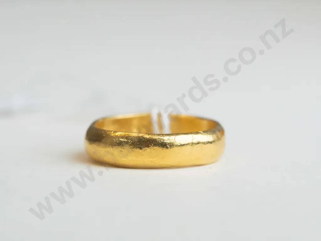 Small gold ring with writing engraved on the inner part of the ring (unreadable)  Image 1++