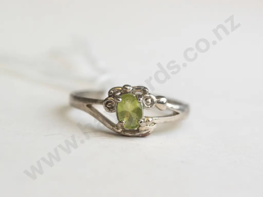 silver ring with green-coloured stone in set Image 1++