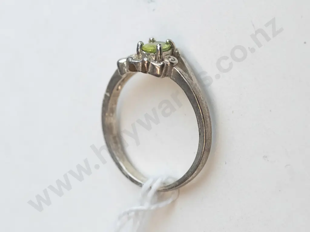 silver ring with green-coloured stone in set Image 1++