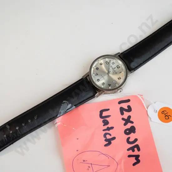 Silver Kienzle watch with black straps