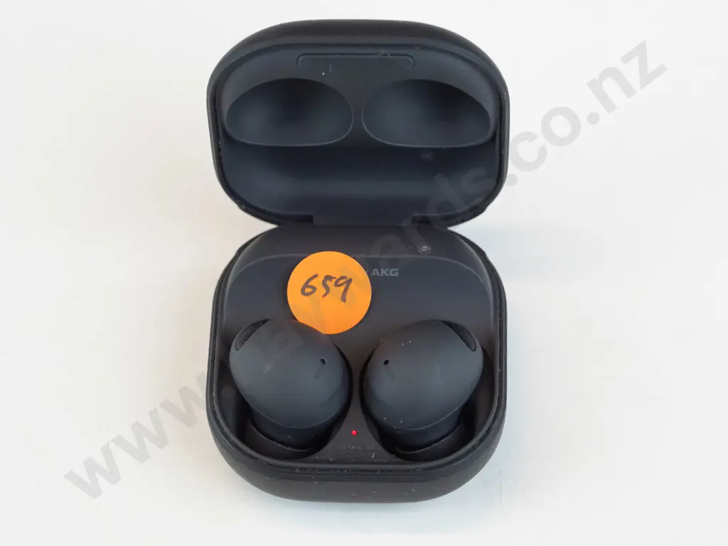 Black Samsung wireless earbuds in case. Image 1++