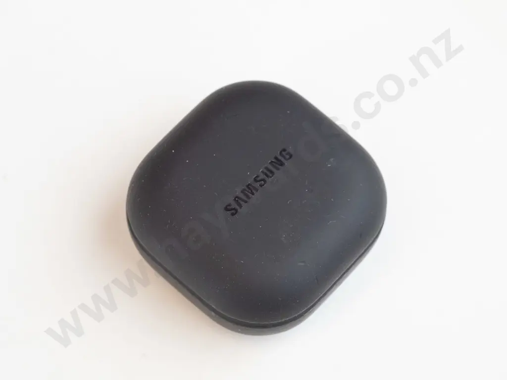 Black Samsung wireless earbuds in case. Image 1++
