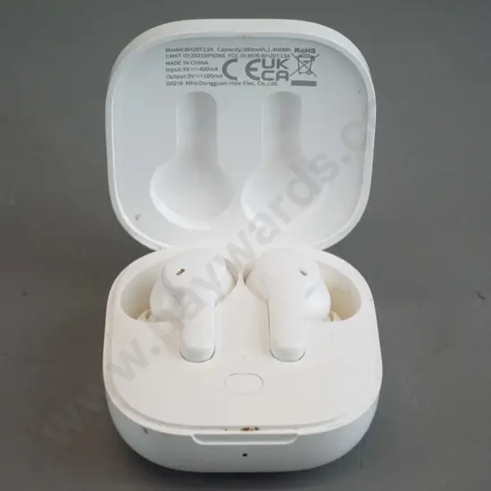 QCY ear buds in charging case