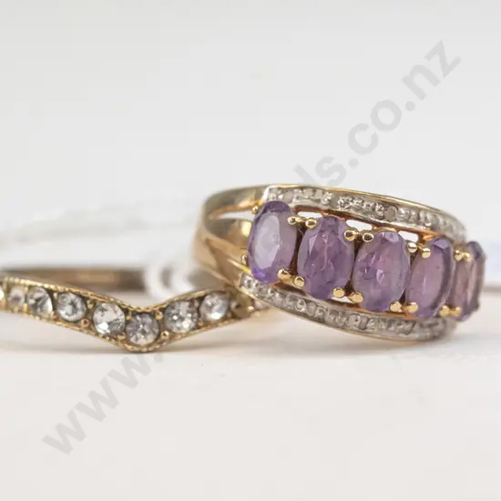 2 golden rings with stones