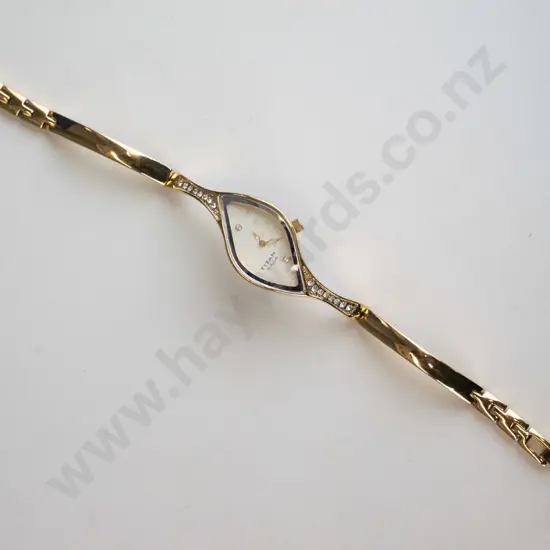 gold coloured diamond shaped watch with white stones