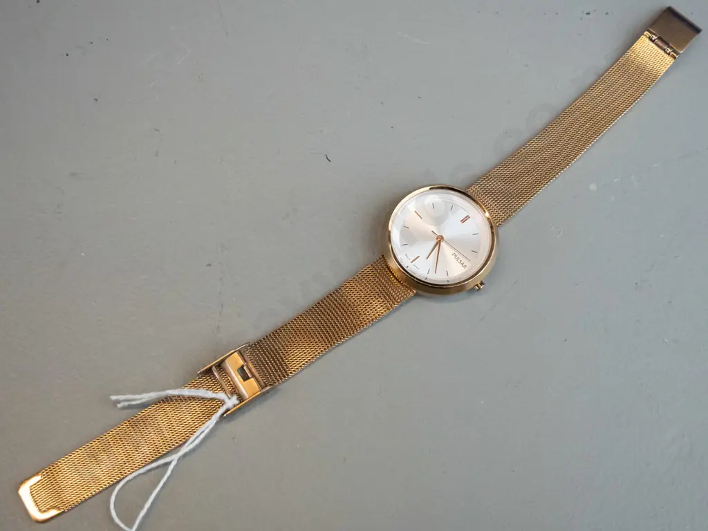 gold coloured Pulsar analogue watch Image 1++