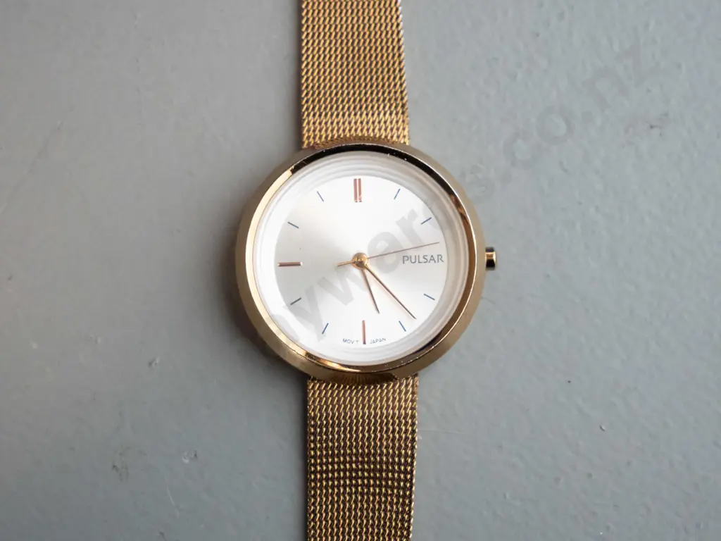 gold coloured Pulsar analogue watch Image 1++