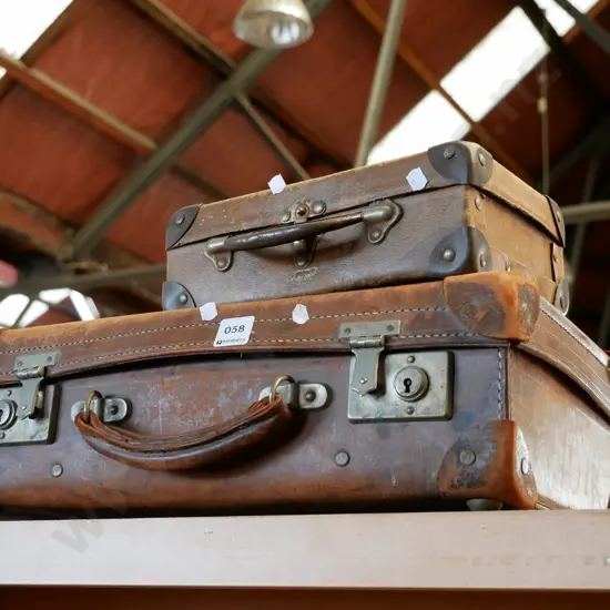 1 leather suitcase and 1 child's case