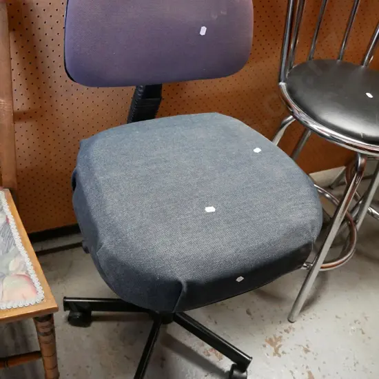 badly upholstered office chair