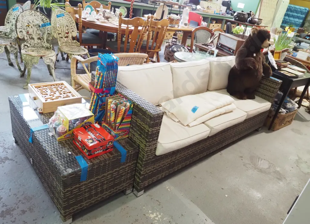 woven plastic outdoor 3 seater setee with foam cushions and glass topped coffee table Image 1++