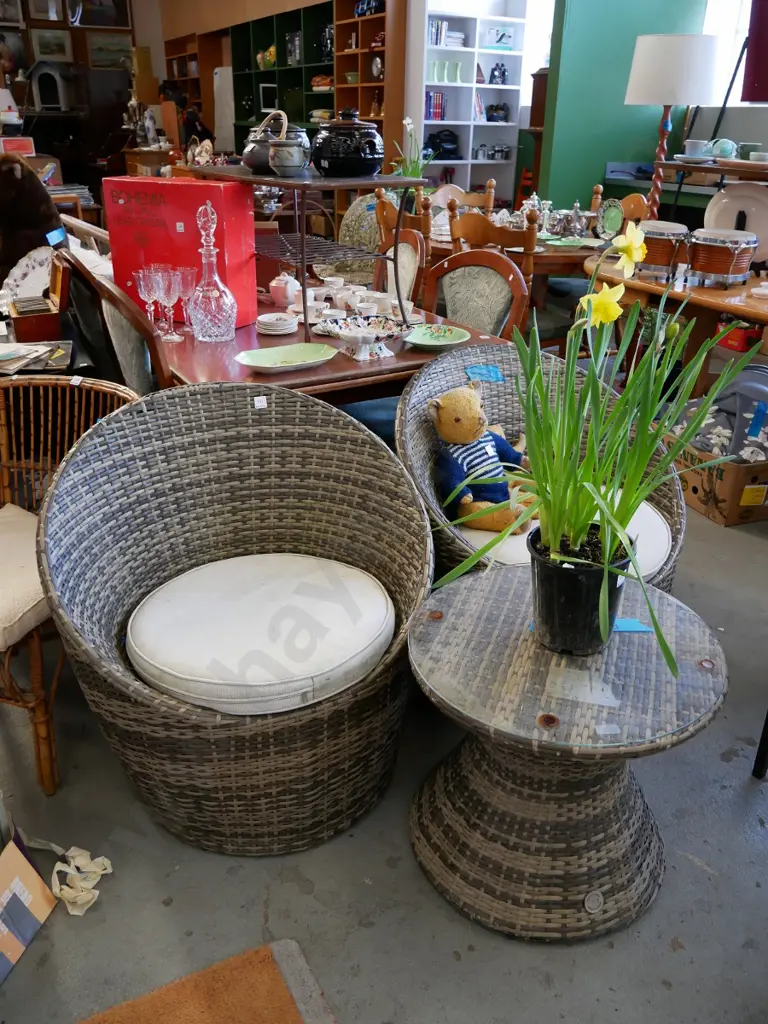 2 woven plastic outdoor tub chairs and cushions and matching glass topped table Image 1++