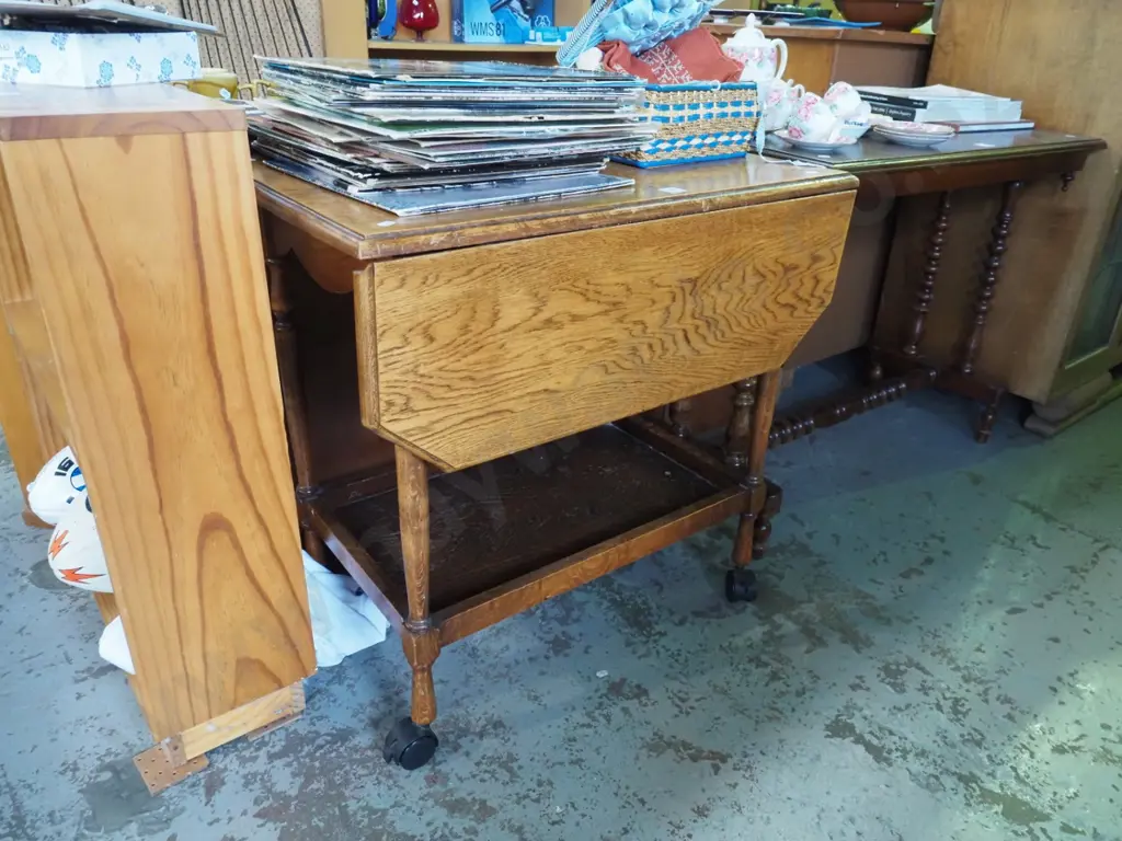 oak drop side tea trolley with plastic casters Image 1++