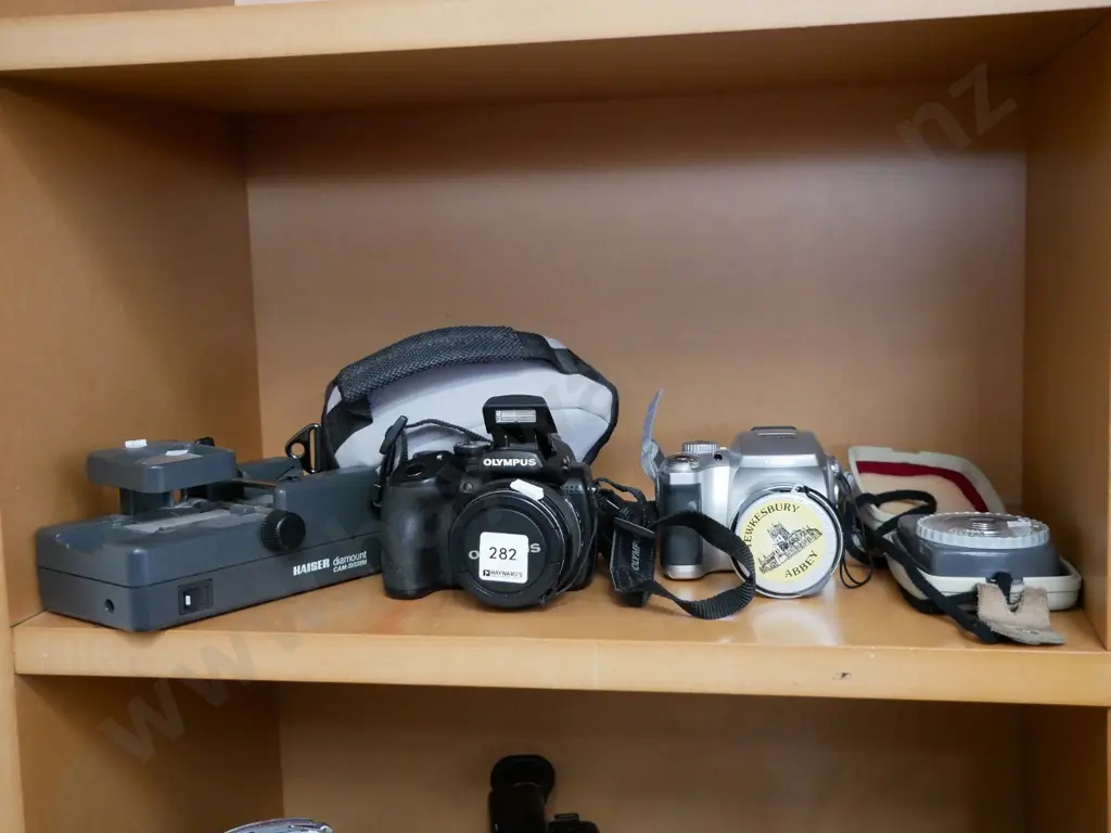 2 digital cameras, light meter, 8mm film editor Image 1++