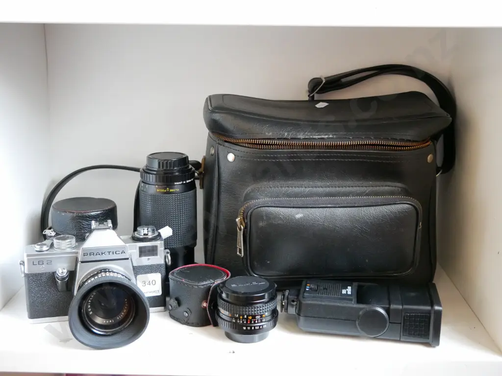 Praktica 35mm camera with camera bags, lenses, and flash Image 1++
