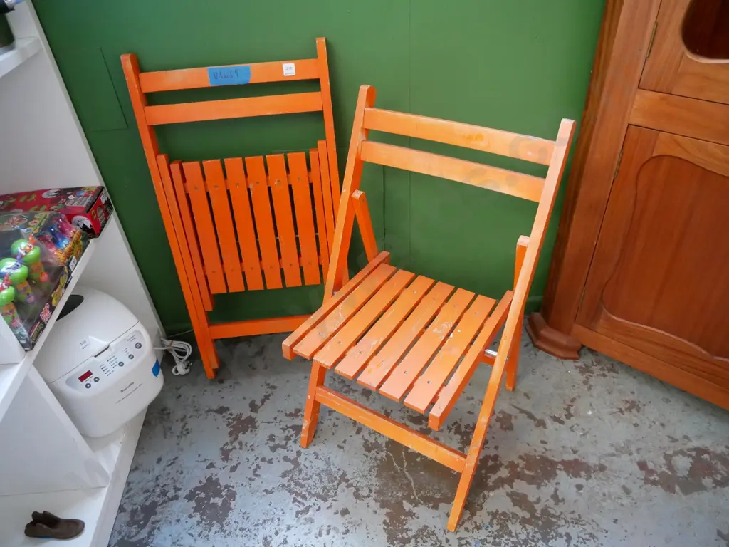 2 orange deck chairs Image 1++