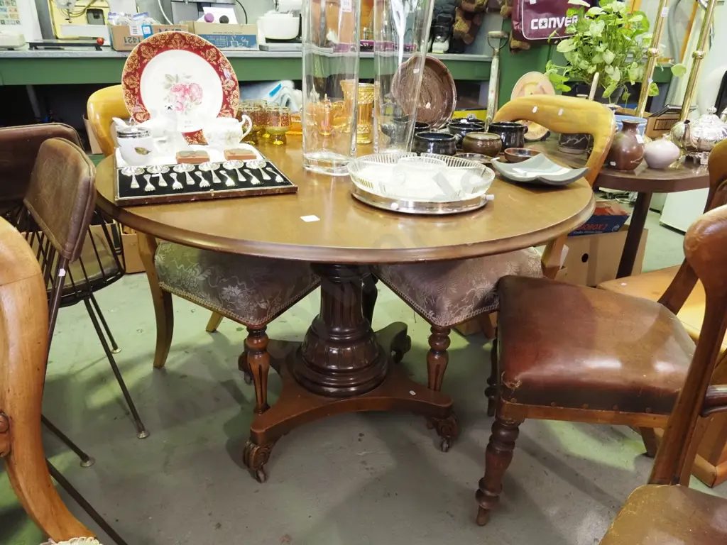 Victorian tilt top loo table on brown enamel casters with 6 mismatched upholstered chairs Image 1++