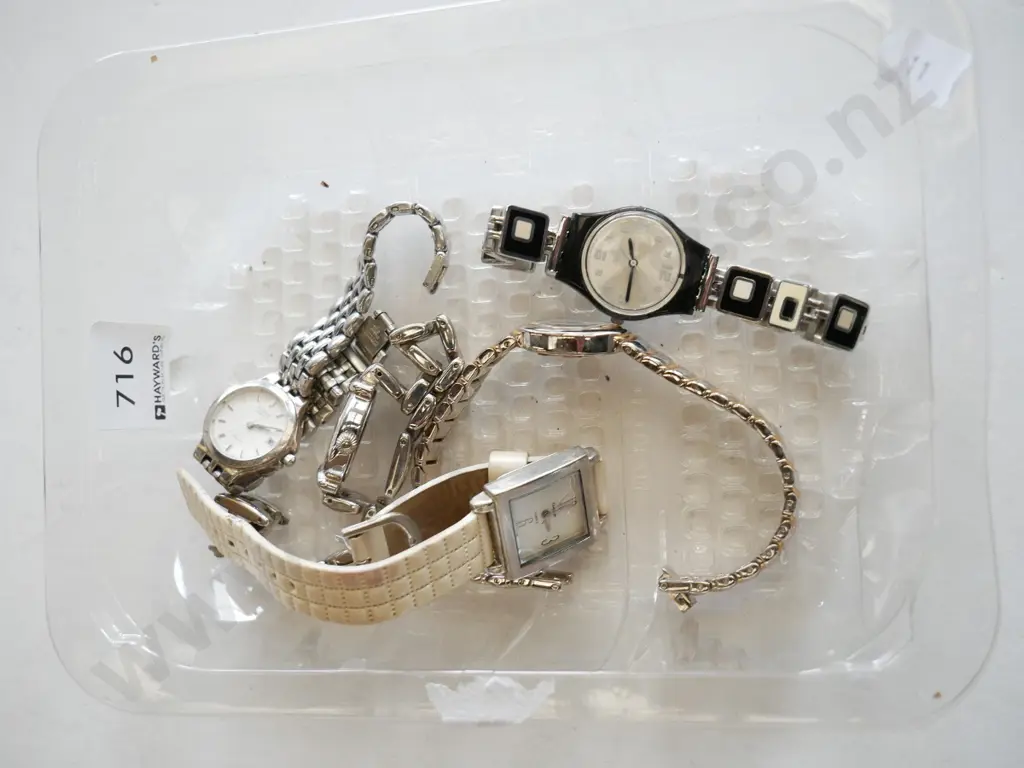 plastic tray of wristwatches Image 1++