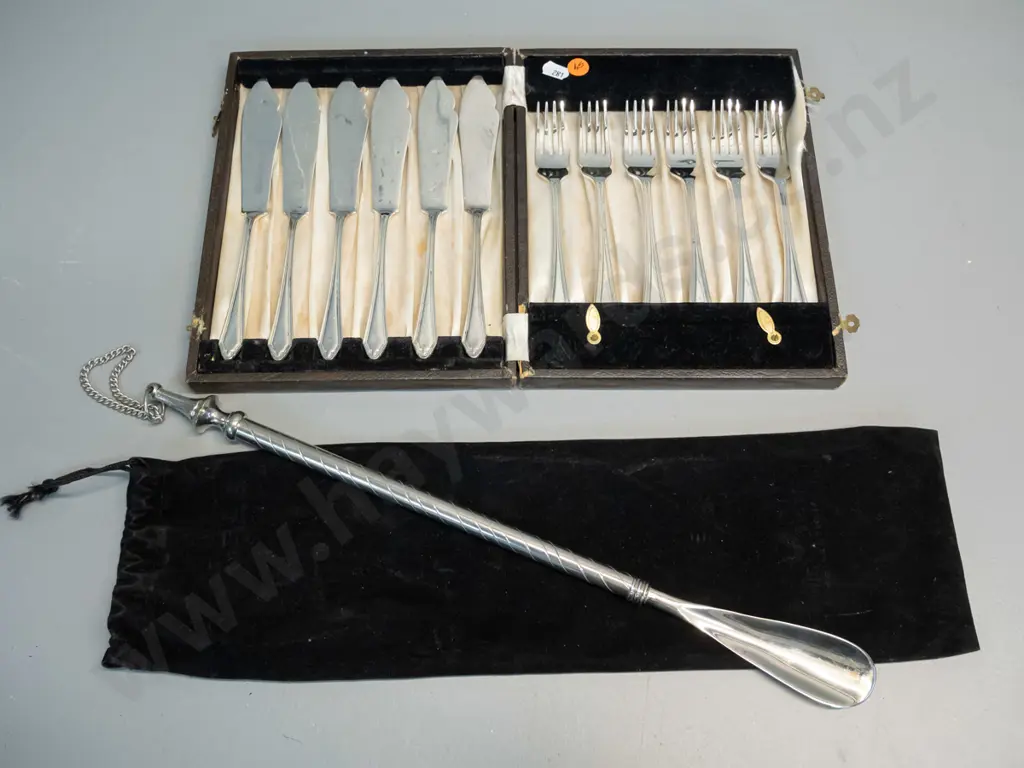 cased set of EPNS fish knives and forks - scratches to knives - and a plated shoehorn L-440 in drawstring bag Image 1++
