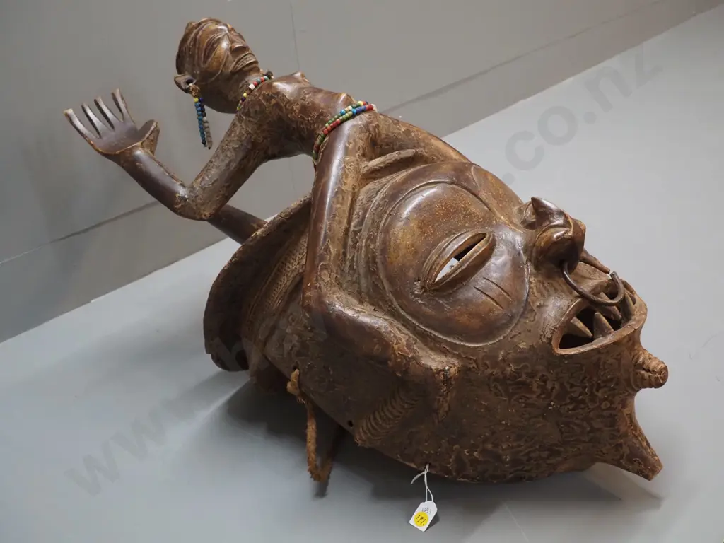 very large African decorative helmet mask with length of rope and various bead adornments. H780 W350 D400 Image 1++