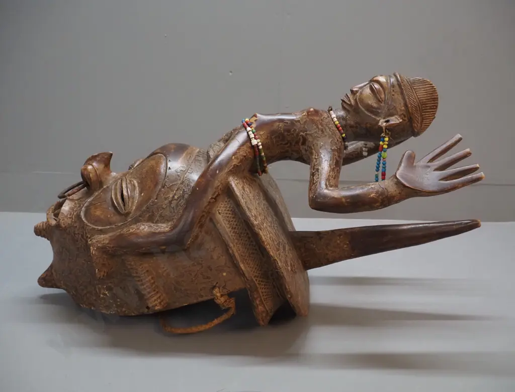 very large African decorative helmet mask with length of rope and various bead adornments. H780 W350 D400 Image 1++