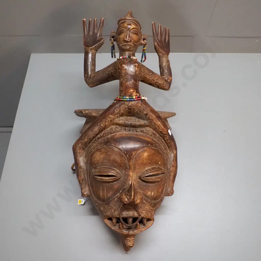 very large African decorative helmet mask with length of rope and various bead adornments. H780 W350 D400 Image 1++