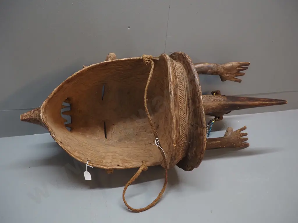 very large African decorative helmet mask with length of rope and various bead adornments. H780 W350 D400 Image 1++