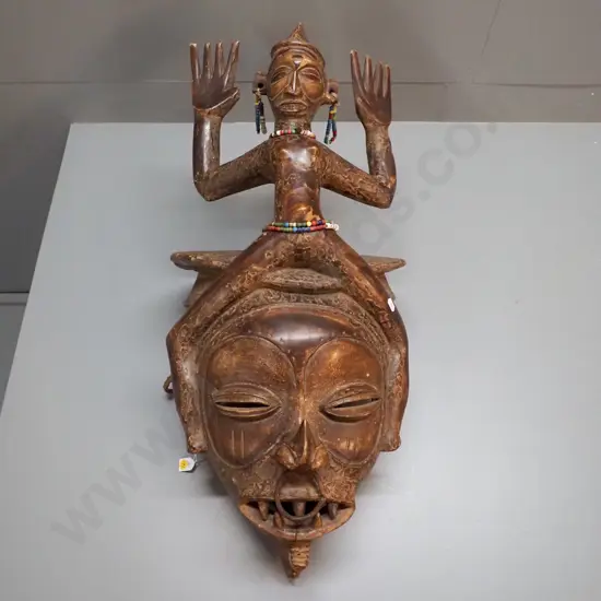 very large African decorative helmet mask with length of rope and various bead adornments. H780 W350 D400