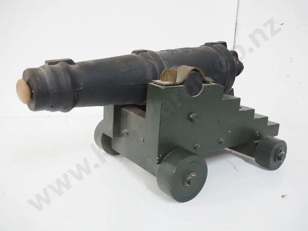 small very heavy cast metal cannon on wooden trolley w/ cannon design blueprint. Overall H-320 L-610 W-370 Barrel L-540 Image 1++