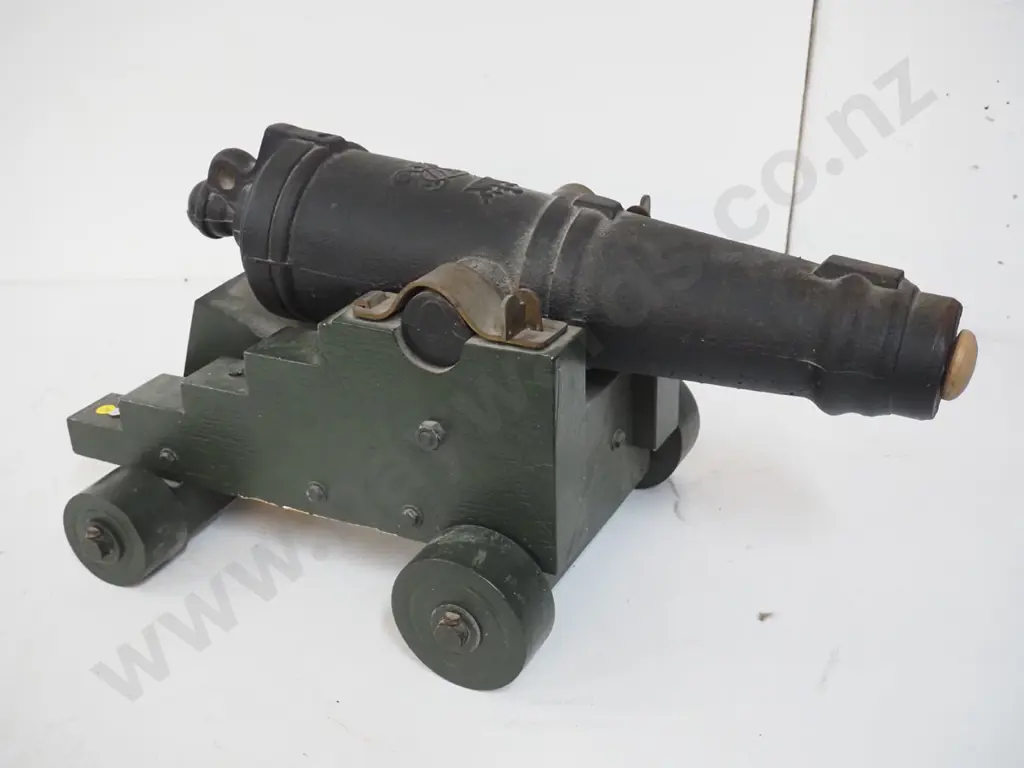 small very heavy cast metal cannon on wooden trolley w/ cannon design blueprint. Overall H-320 L-610 W-370 Barrel L-540 Image 1++