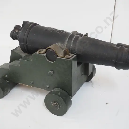 small very heavy cast metal cannon on wooden trolley w/ cannon design blueprint. Overall H-320 L-610 W-370 Barrel L-540