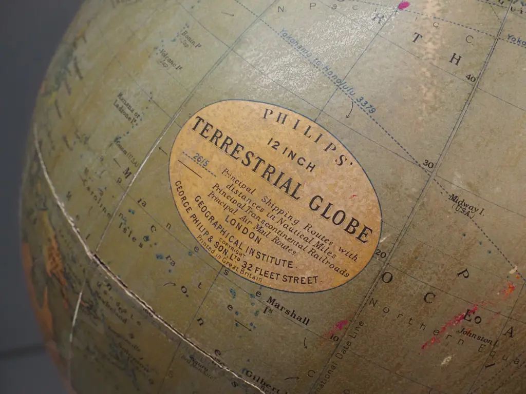 vintage George Philip & Son world globe on heavy cast metal base - crack/separation around seam, some fading Image 1++
