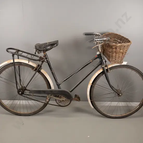 restorer's vintage bicycle - Coventry Eagle England badges, has extensive wear and corrosion, with worn wicker basket.
