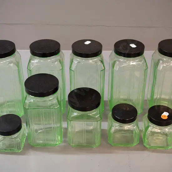 10 uranium glass kitchen storage canisters with bakelite lids - 5 different sizes, largest are H-200