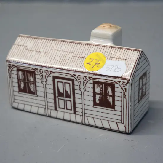 Air New Zealand ceramic bottle in shape of colonial house - with contents, cork looks to be sealed with wax H60 L90 D40