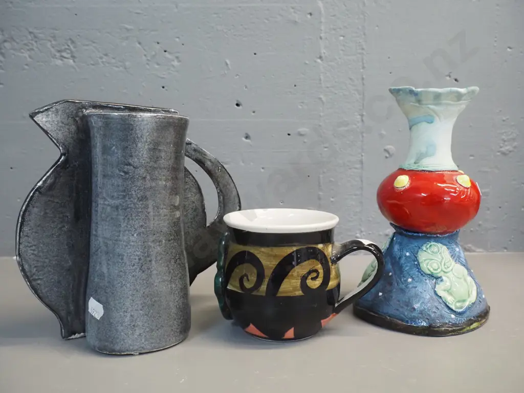 3 pieces New Zealand studio pottery - handled vase by Pink Paua / Liz Earth, tiki mug (unknown mark) and jug-shaped slab Image 1++