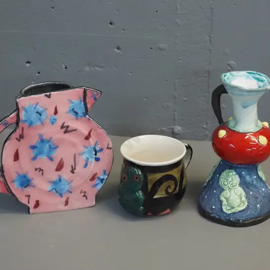 3 pieces New Zealand studio pottery - handled vase by Pink Paua / Liz Earth, tiki mug (unknown mark) and jug-shaped slab