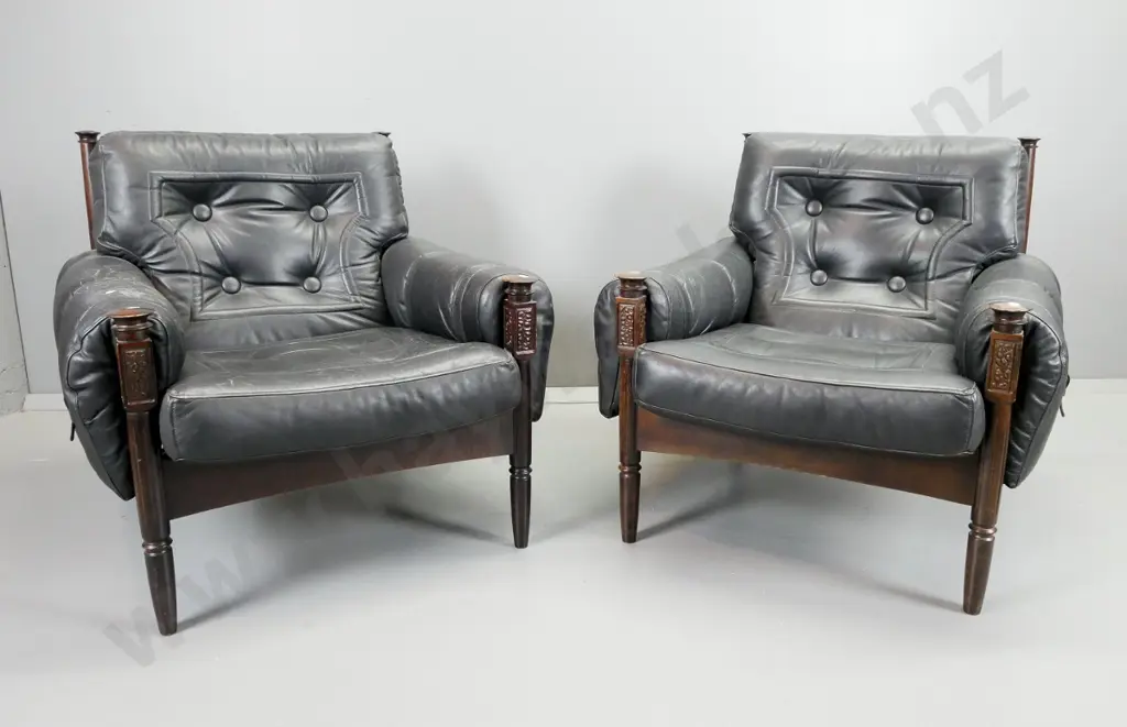 pair of mid-century leather slung armchairs with stitched leather panels and large buttons, turned front legs with Image 1++