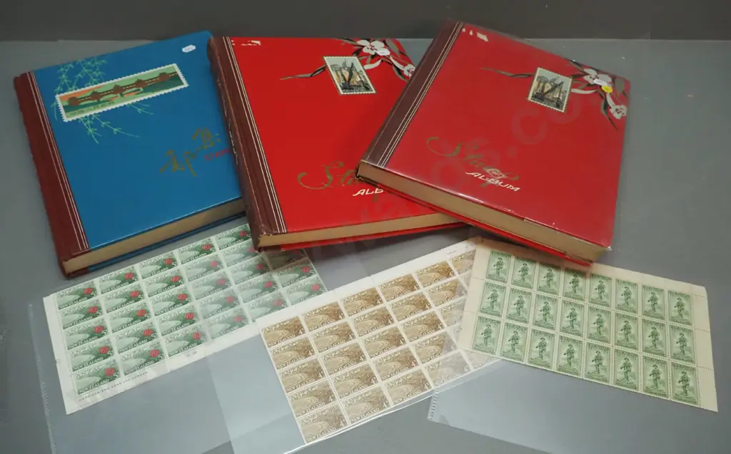 3 stamp albums ranging from 1906 thru 1969, and 3 sheets of ANZAC commemorative stamps. One album is part, 1914 and 1965 Image 1++